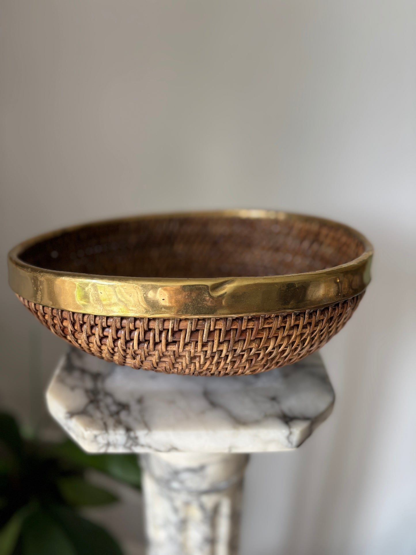 Vintage brass rimmed rattan basket