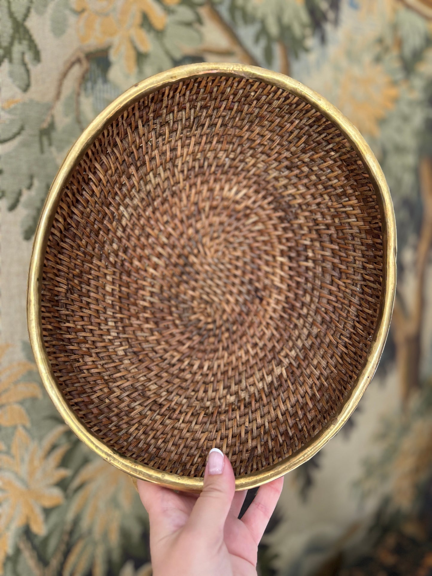 Vintage brass rimmed rattan basket