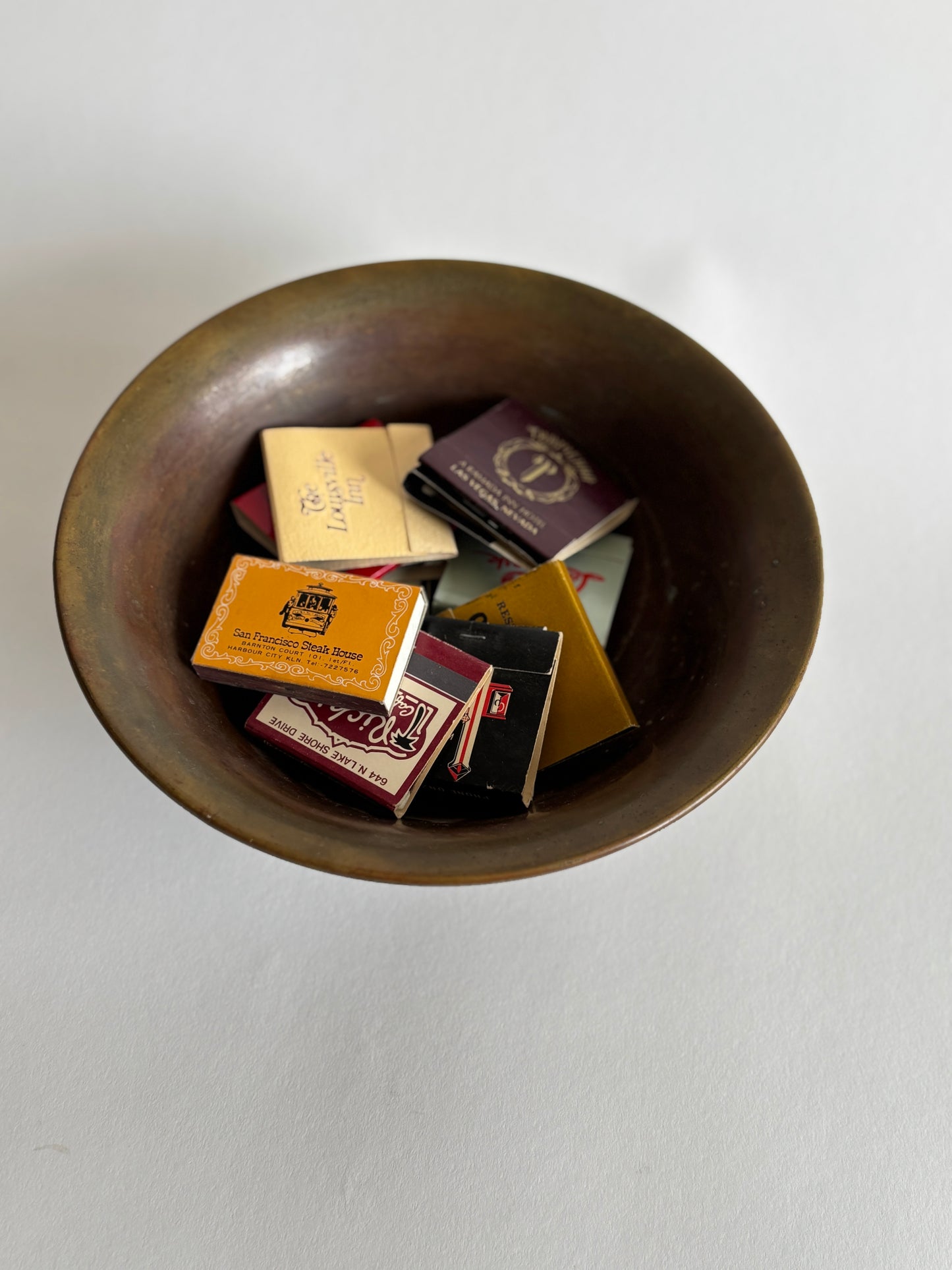 Footed brass bowl w/ vintage matchbooks