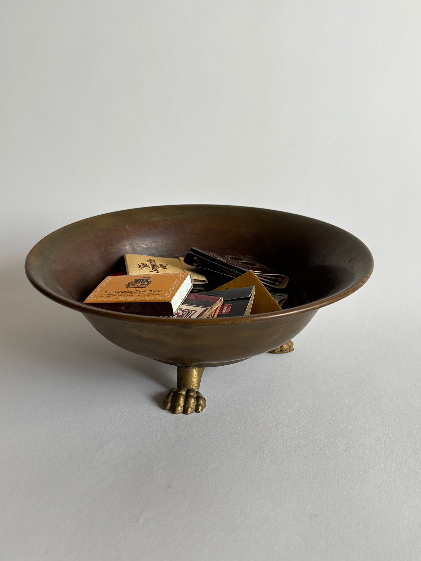 Footed brass bowl w/ vintage matchbooks